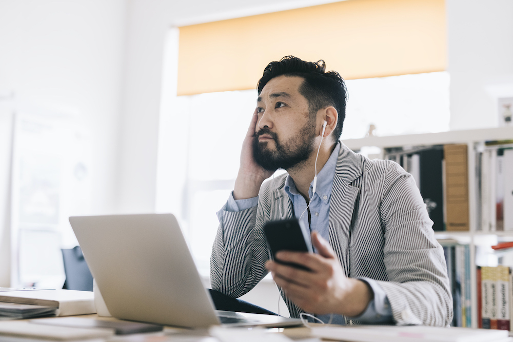 man-listening-on-phone